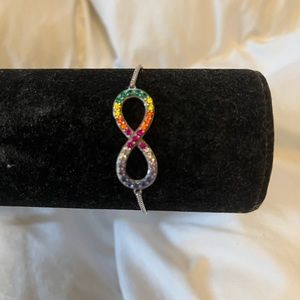 Silver adjustable bracelet. Simulated stones